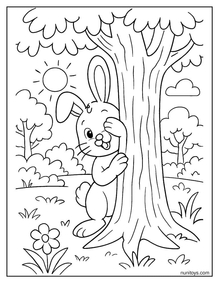 Coloriage lapin jouant à cache-cache derrière un arbre