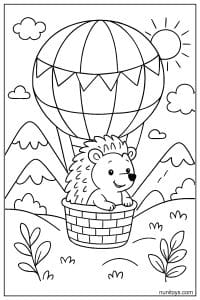 דף צביעה של קיפוד בסל כדור פורח מעל הרים